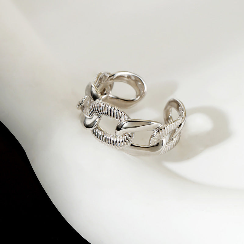 Silver chain ring on a white background.