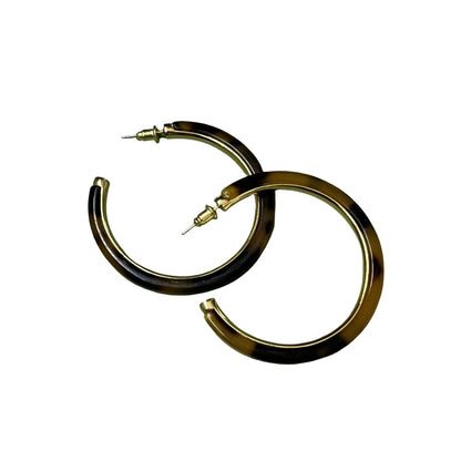 Gold hoop earrings on a white background